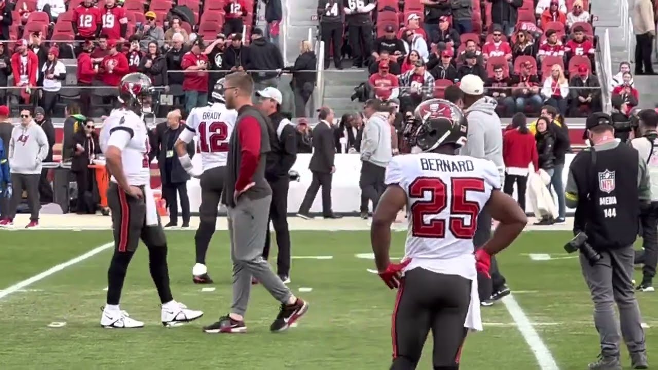 Tom Brady chats with 49ers QB coach and fellow Michigan man Brian Griese