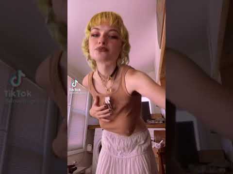 Very sexy girl dances in crop top and reveals underboob. Big nipples!
